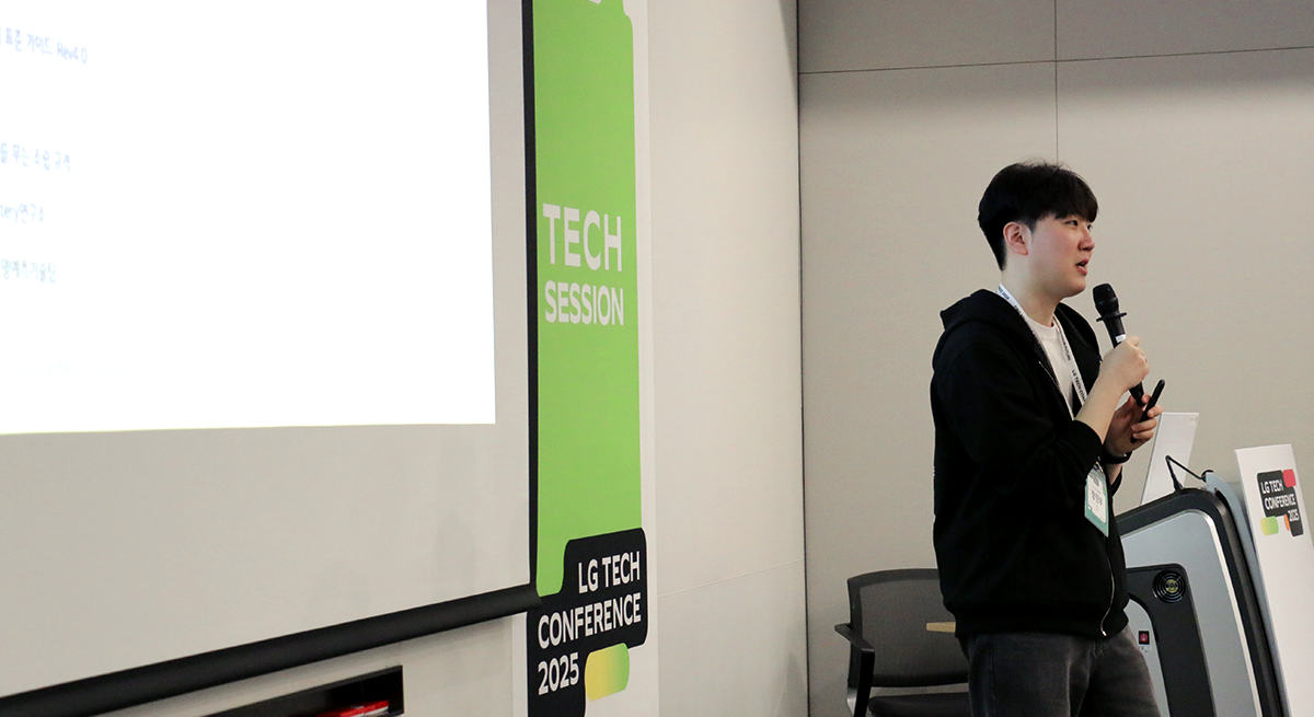 a man standing in front of a screen