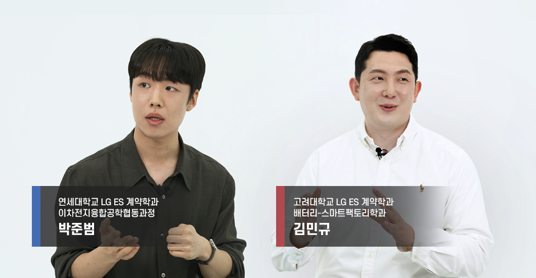 two men standing together with their hands up