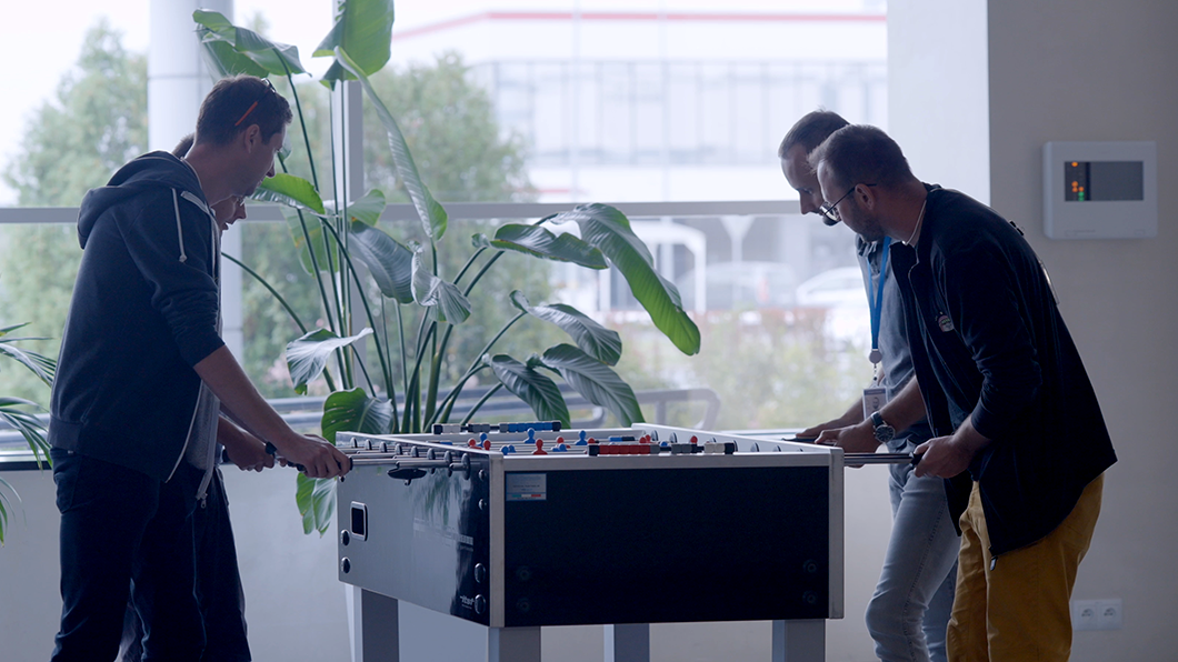 a group of men playing foosball