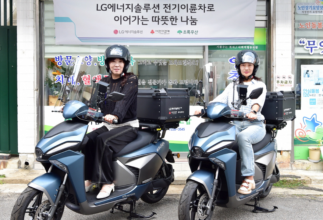 two women on a scooter