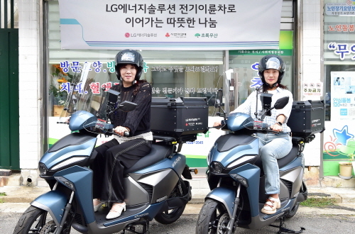 two women on a scooter
