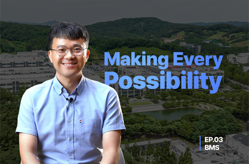 a man smiling in front of a landscape