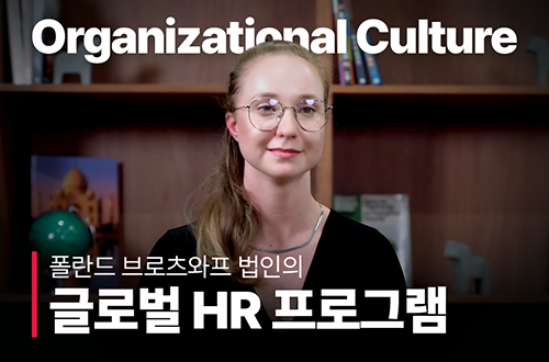 a woman wearing glasses and a black shirt