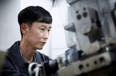 a man looking at a machine